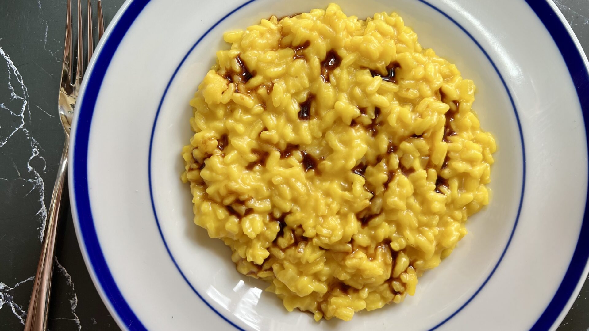 carnaroli rice saffron risotto with traditional balsamic vinegar